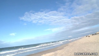 Two horny guys walking along Brazilian beach